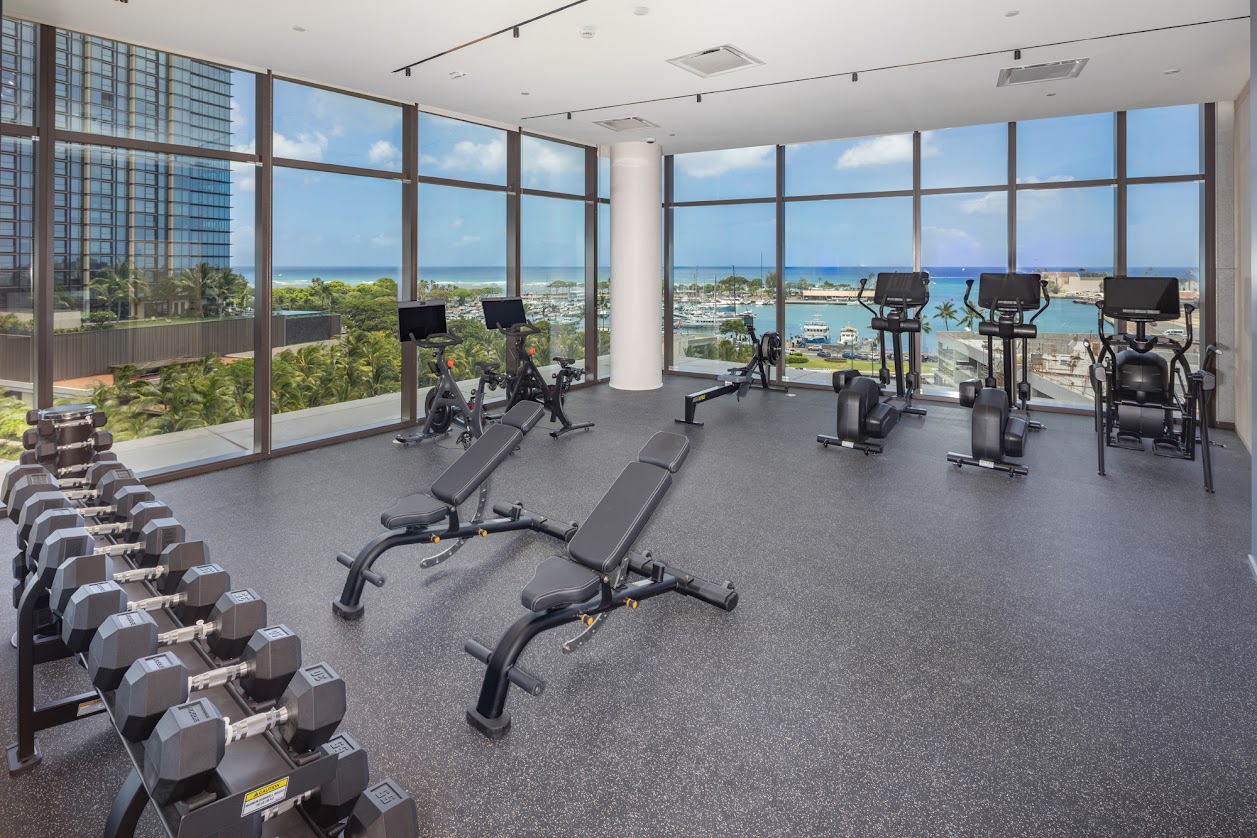A gym with a view of the ocean.